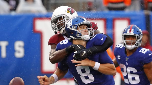 Oct 20, 2019; East Rutherford, NJ, USA; New York Giants quarterback Daniel Jones (8) fumbles the ball after a hit by Arizona Cardinals cornerback Patrick Peterson (21) during the second half at MetLife Stadium.